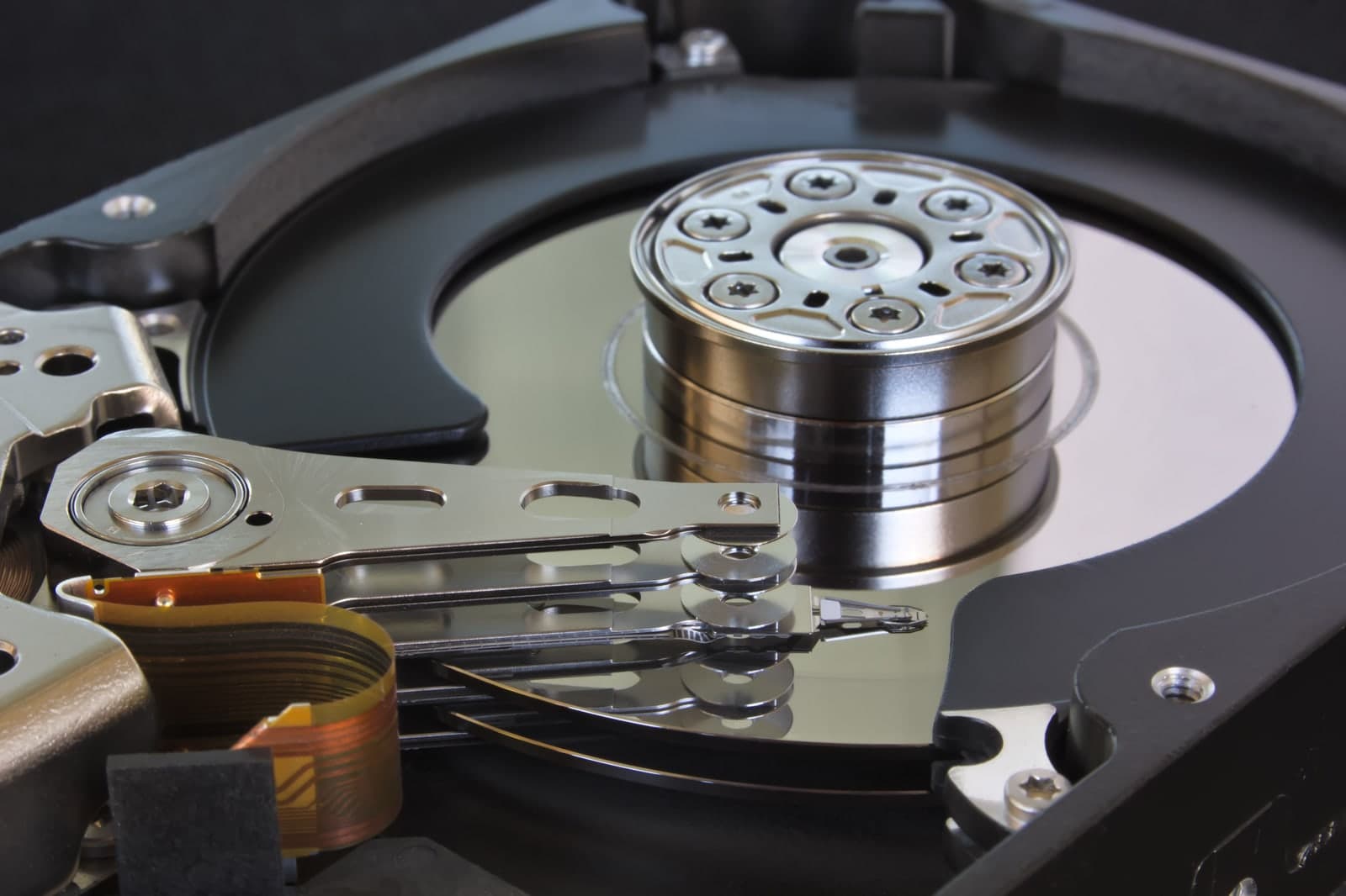 Open hard drive with platters and read/write heads on actuator arms