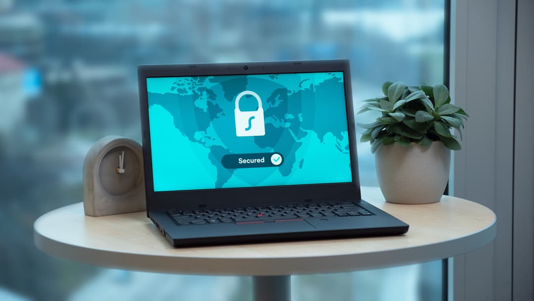 Laptop displaying a security lock screen for a Windows patch readiness article