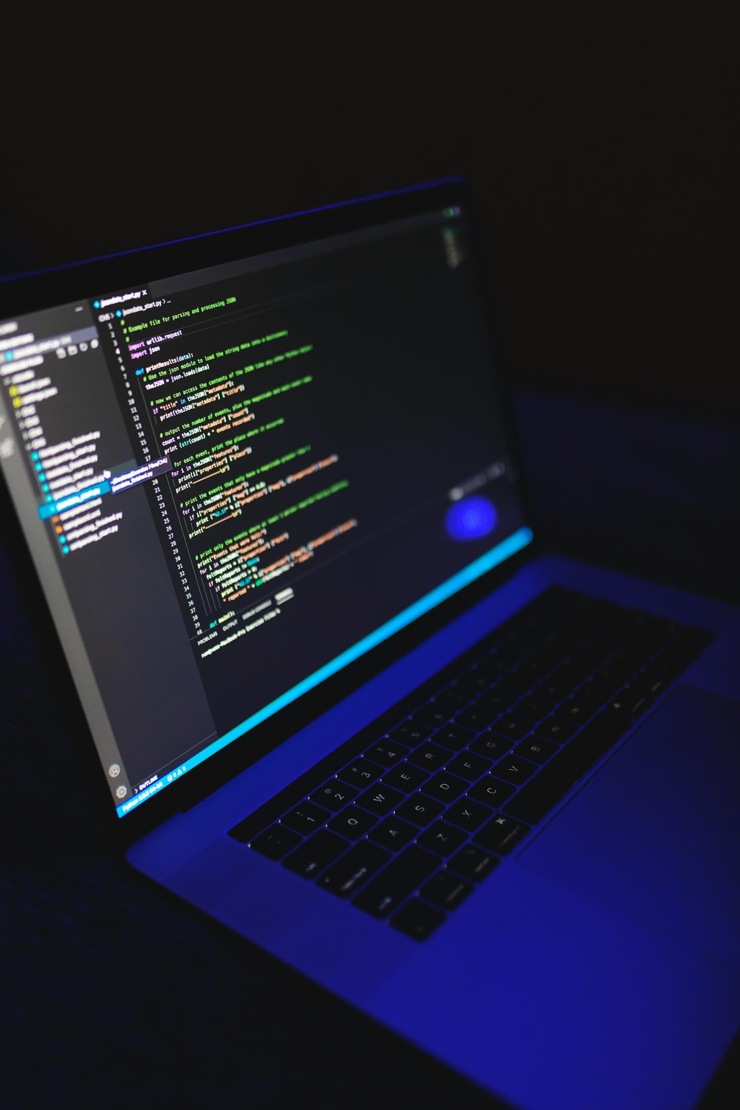 Photorealistic coding workstation in a dark technical environment representing PowerShell automation